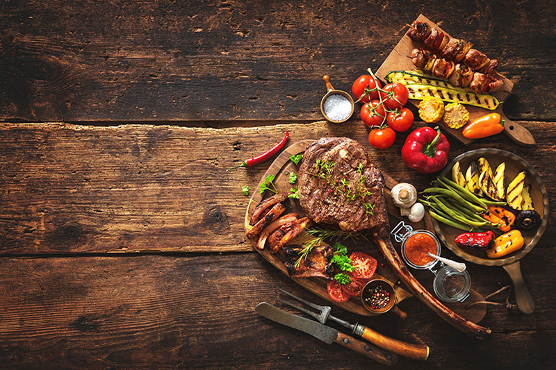 Guys Night Food Steak filets set up for grilling after being prepared for a guy's night event.