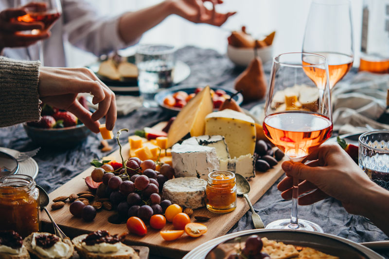 A Ladies's Night gathering as guests enjoy food and conversation prepared by an event catering staff.